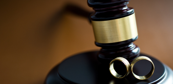 Gavel with wedding rings